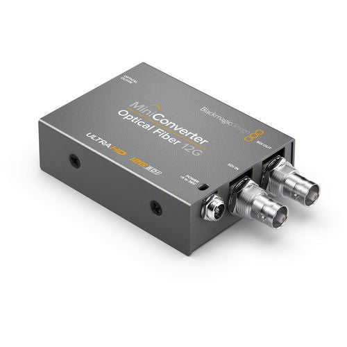 Mini Converter Optical Fiber 12G, top view with dark metal case and two coax connectors