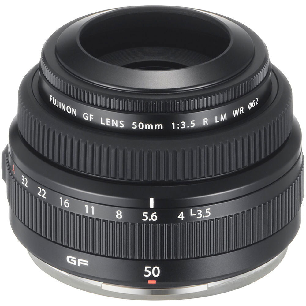 Black 50mm f/3.5 lens side view with ribbed grip, aperture ring numbers, and base rim