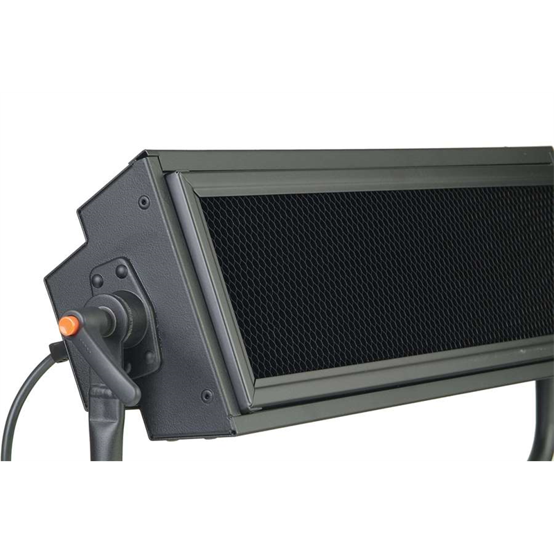 Black light control on side with orange button; vented front grille visible