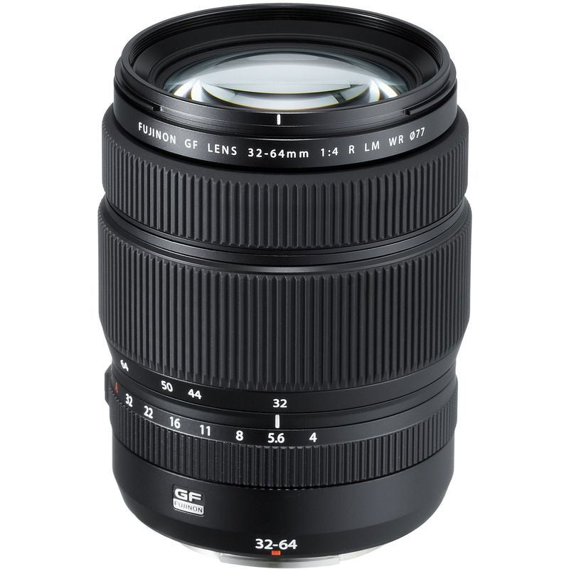 32-64mm mirrorless zoom lens in black, front barrel markings and filter rim