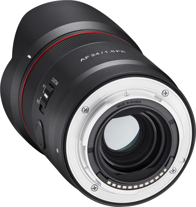 Back view of black AF 24mm f/1.8 FE lens with silver mount contacts and red stripe