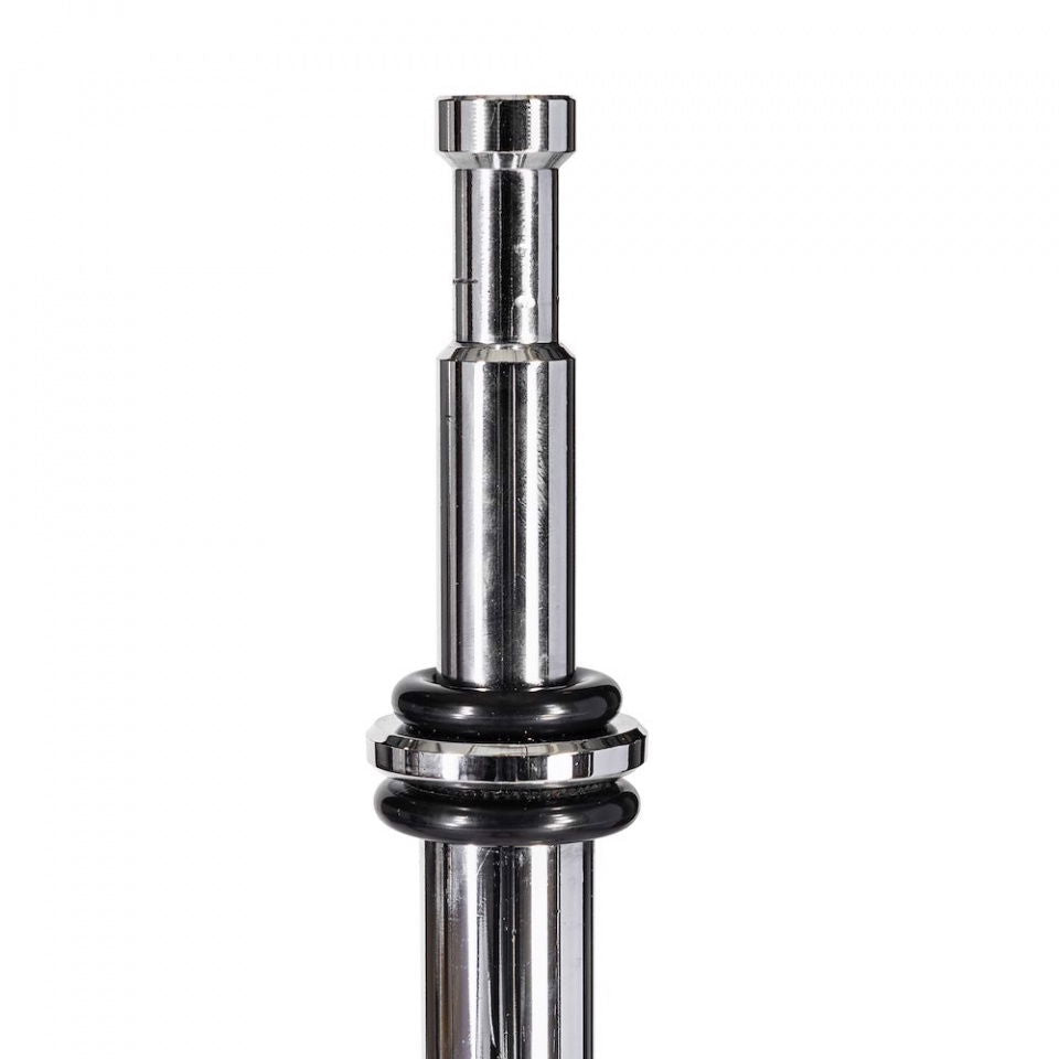 Close-up of chrome riser joint with black rubber spacer