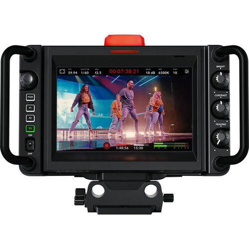 Studio camera with built-in screen showing a video timeline, red tally on top
