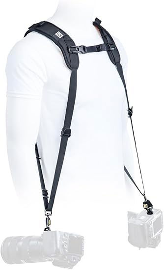 Black dual shoulder harness with webbing straps and hanging camera clip ends