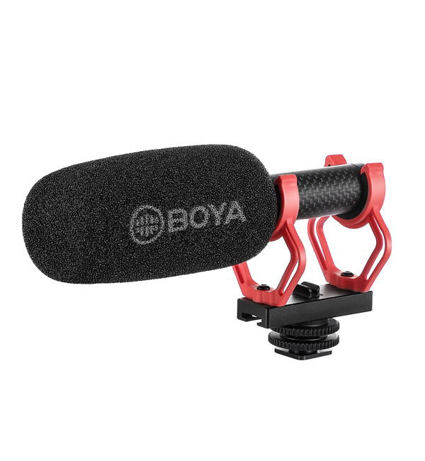 Shotgun condenser microphone with large foam windscreen and red shock mount