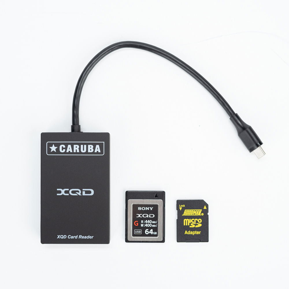 USB-C XQD card reader with microSD adapter and card, showing XQD slot