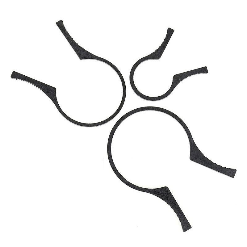 Set of four black circular filter-unlock tools with grip tabs