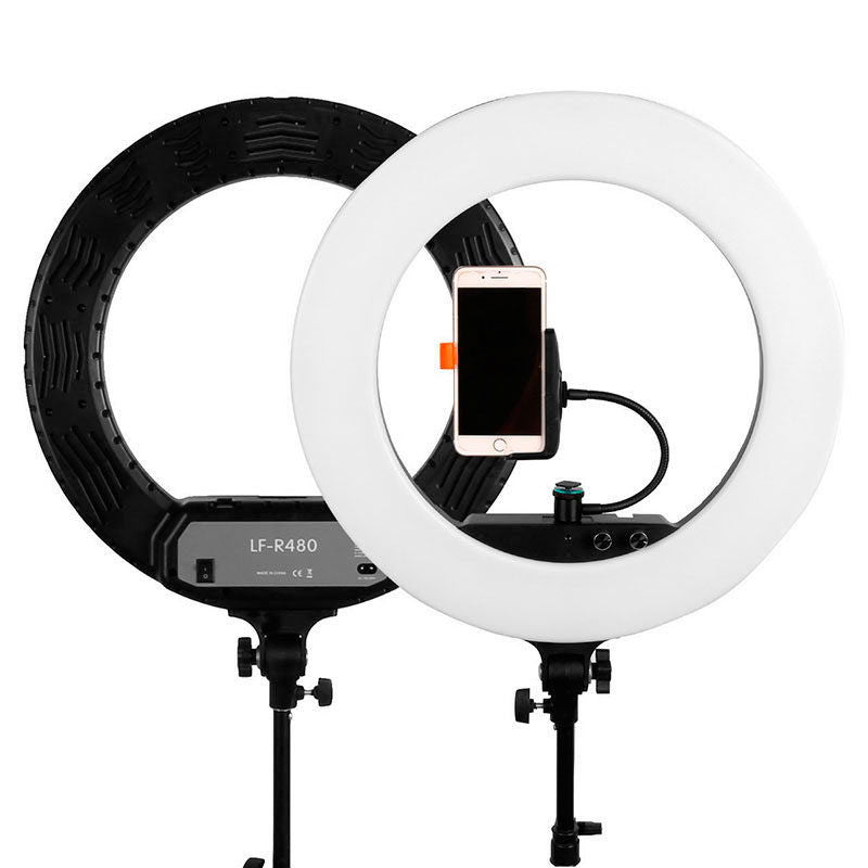 Dual ring lights display: white front ring and black rear ring, with phone holder mount