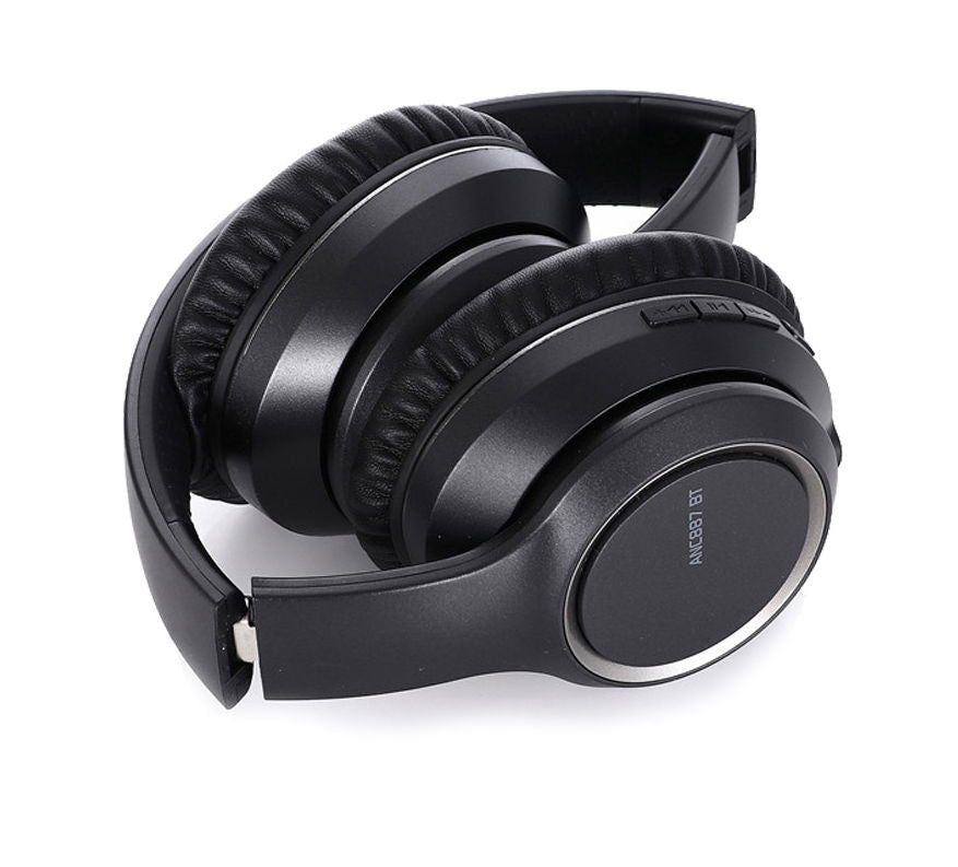 Black over-ear headphones with cushioned earcups and touch/arrow buttons on side