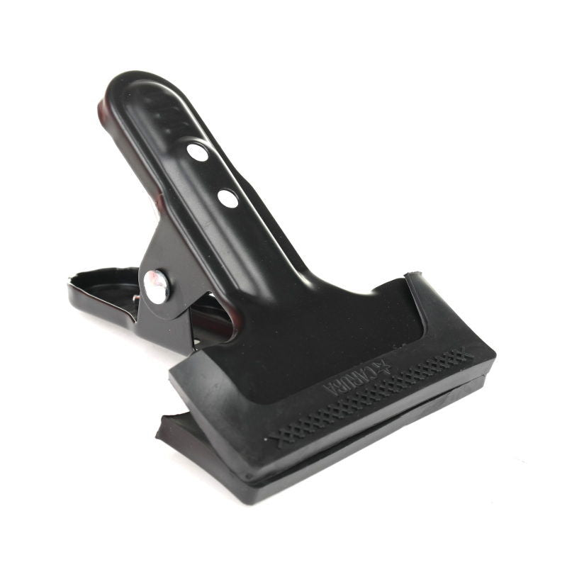 Black heavy-duty clamp with serrated rubber grip and metal hinge pin, close-up