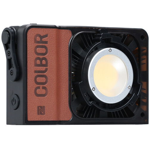 Portable 100W LED RGB light with front circular lens and housing vented sides