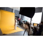 Yellow photo backdrop panel for studio use, shown in setup