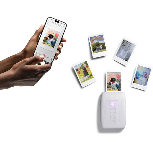 Instax Mini Link 3 printer with multiple mini photos, connected to smartphone
