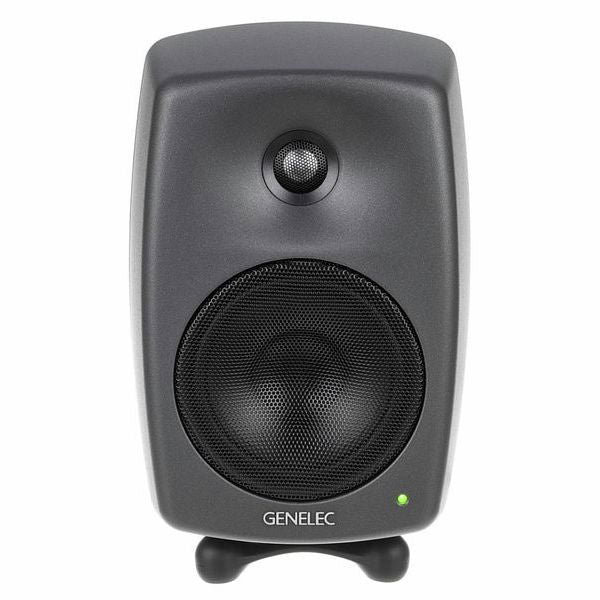 Dark gray active studio monitor speaker, close front view of tweeter and grille
