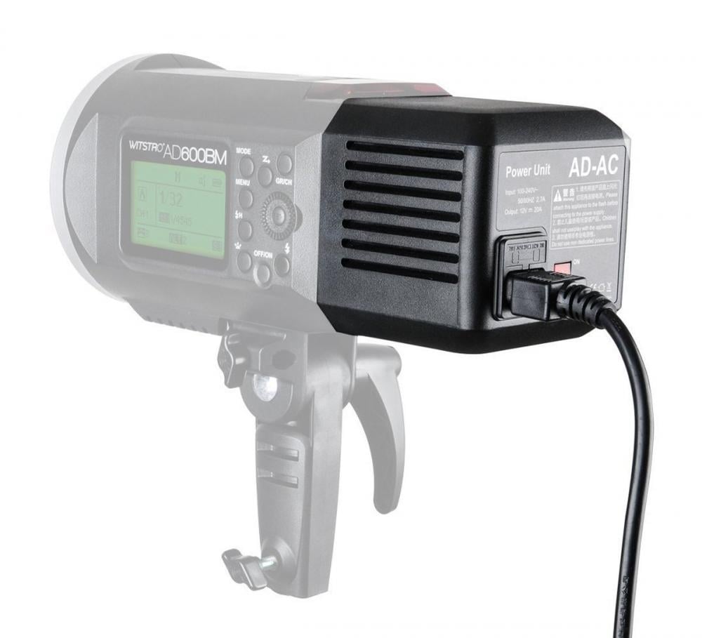 AD-AC power unit for AD600 flash with LCD display, control buttons, and vents