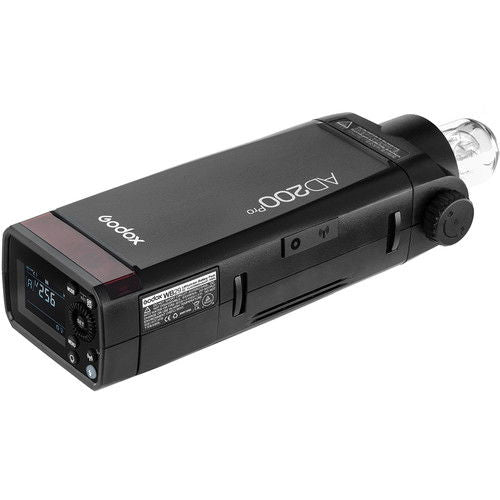 AD200Pro TTL flash side view with LCD display and sync control switches