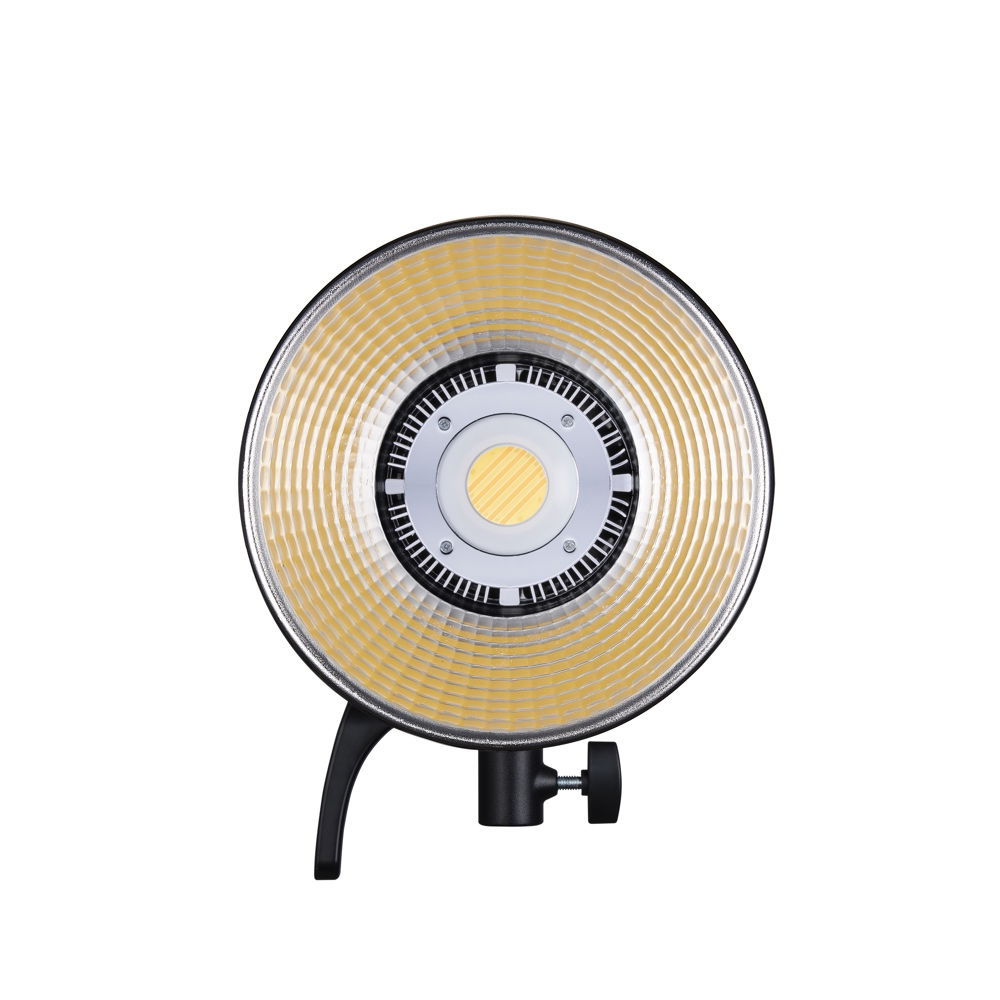 LED studio light front with warm yellow diffuser and circular reflector