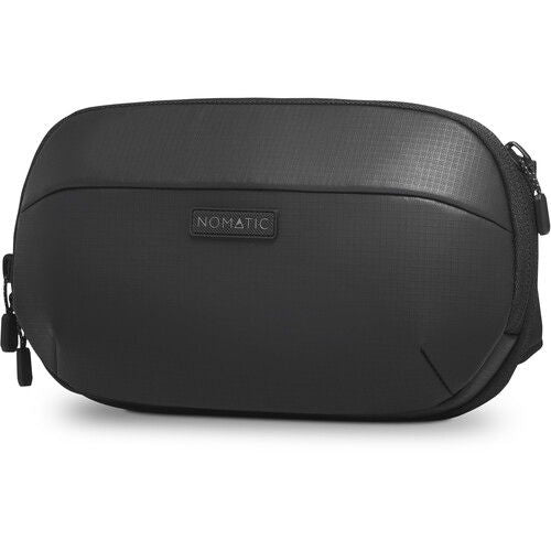 Black sling bag with textured shell, zippered front pocket and logo patch