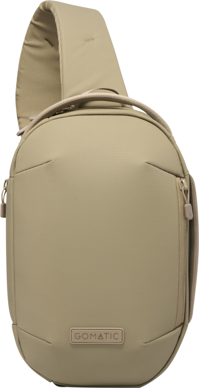 Sand beige sling bag back view with carry handle, logo patch, and rounded silhouette