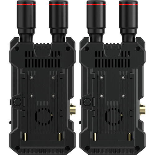 Underside of two wireless video units with vents and power/connector openings