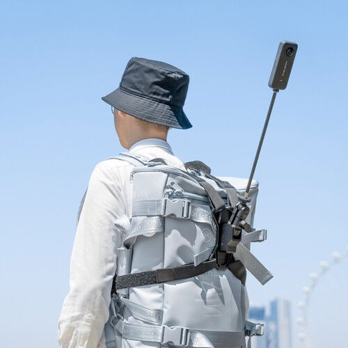 Light gray backpack with third-person camera mount pole and center harness