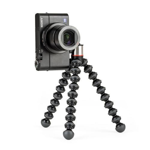Black flexible mini tripod with camera mounted; flexible legs splayed outward
