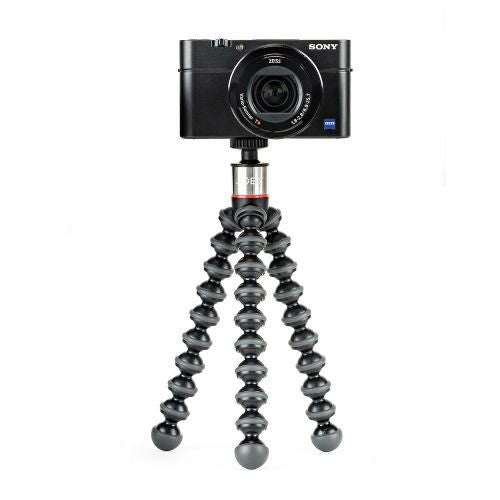 Black flexible mini tripod with camera on top; compact legs in tripod position
