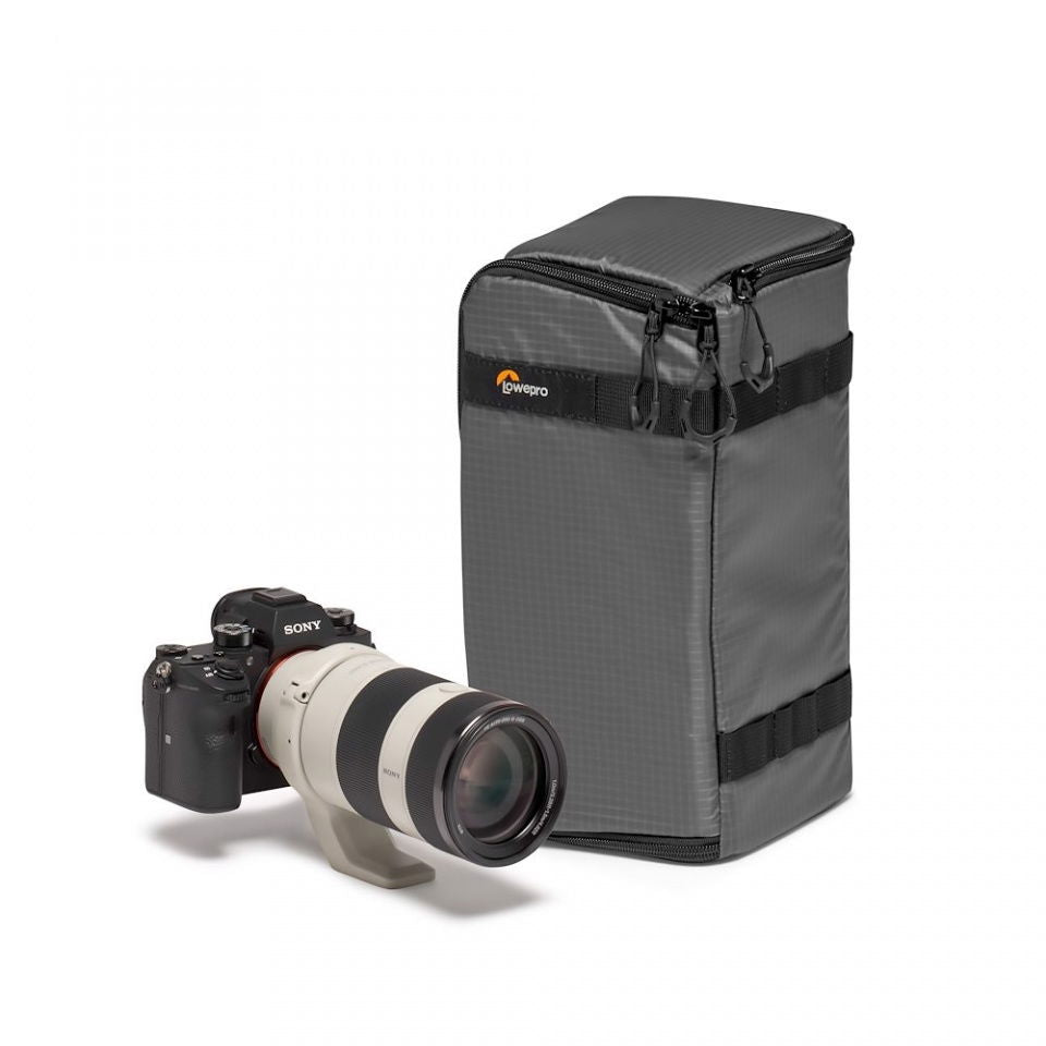 Dark gray camera lens case with zip top opening and black webbing band
