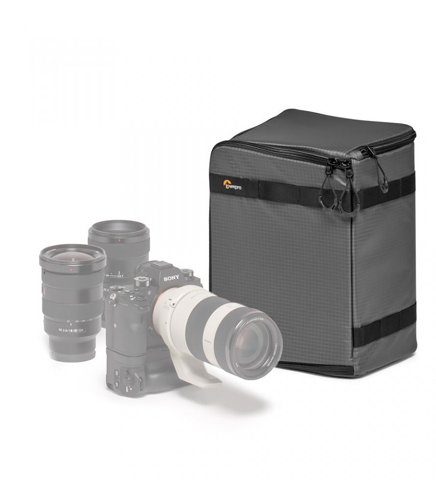 Dark gray photo gear case with top zipper, holds camera and large lens kit