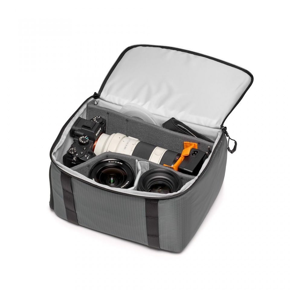 Open dark gray camera case with white lining, compartments for camera bodies and lenses
