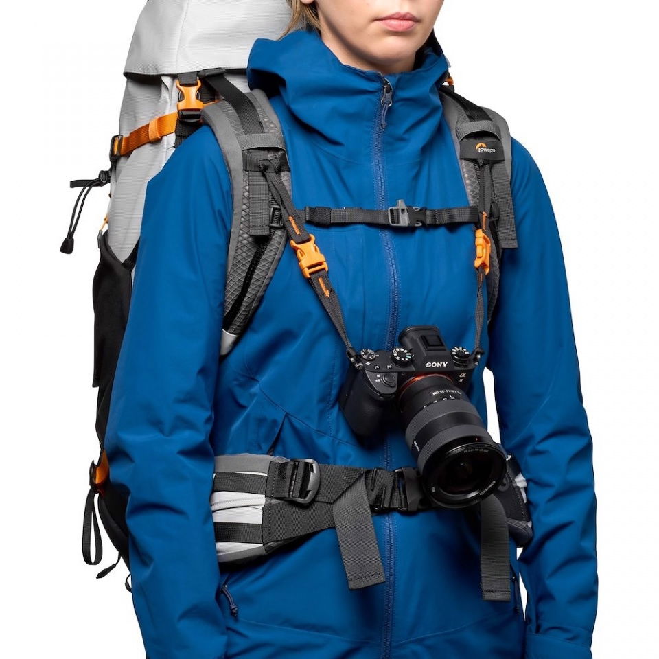 Accessory belt with zip pouch worn with adjustable shoulder straps for camera carry
