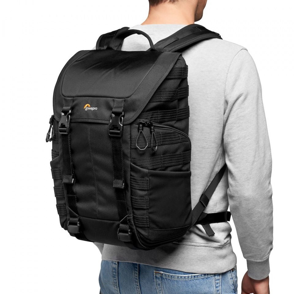 Black photo backpack back view with padded shoulder straps and grab handle
