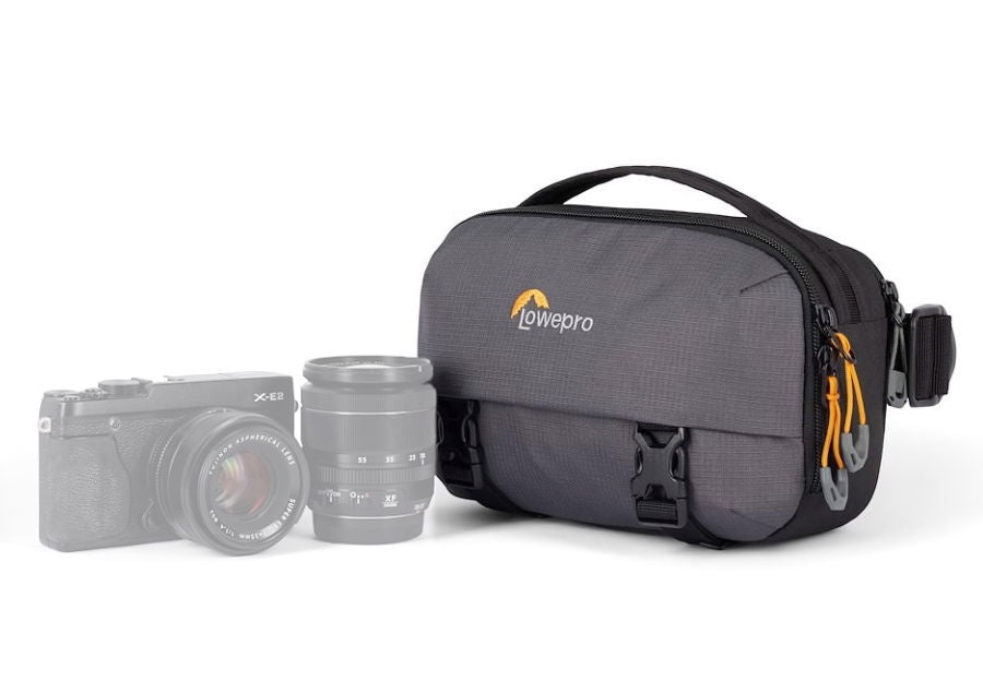 Gray camera shoulder bag with top handle, front zipper and buckled strap