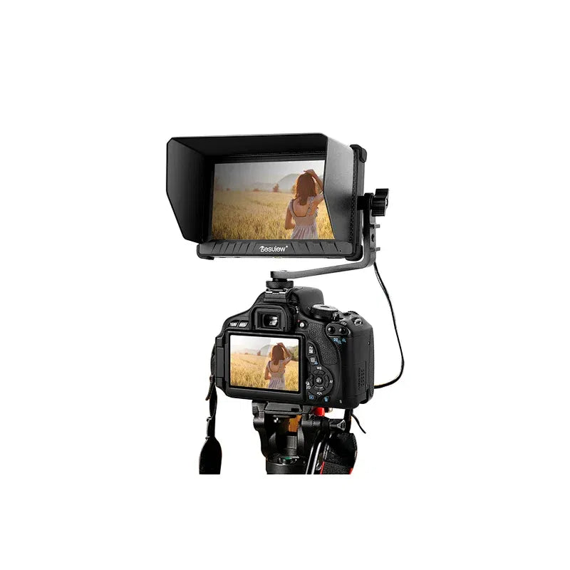 On-camera monitor mounted on camera rig, black 5.5-inch display