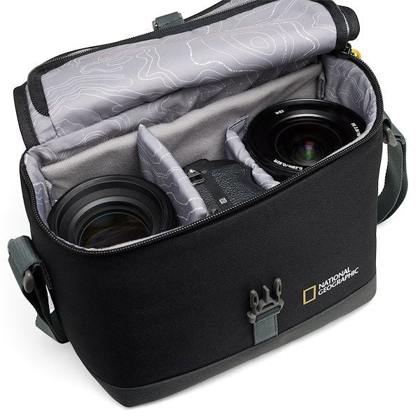 Black photo camera bag with lid open; interior fits DSLR camera and lenses