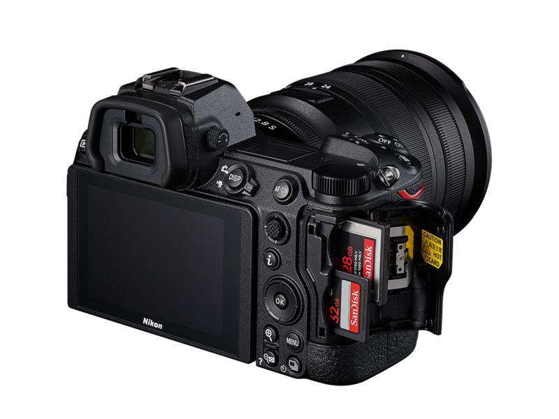 Mirrorless camera with 24-70mm lens, rear/side view, tilting LCD visible