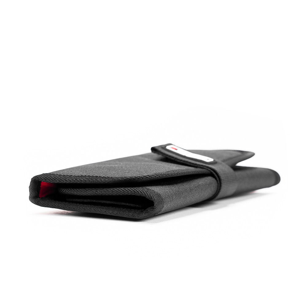 Folded grey filter case with black strap and small label