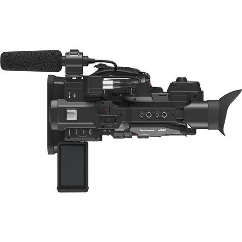 Black camcorder side view with foam windscreen, buttons, and microphone mount