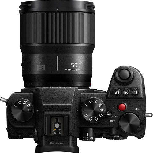 Black L-mount 50mm f/1.8 lens mounted on camera body, controls visible