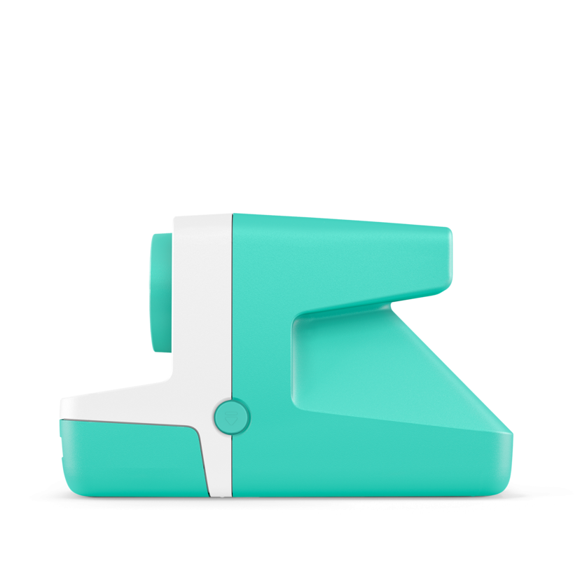 Mint instant camera side view with white grip strip and top control dial