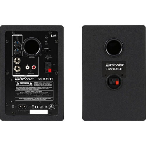 Studio monitor speaker rear panel with audio inputs, knobs, and power connections.