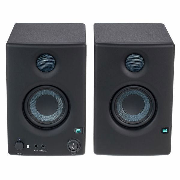 Front view of left and right dark speakers with tweeters and controls
