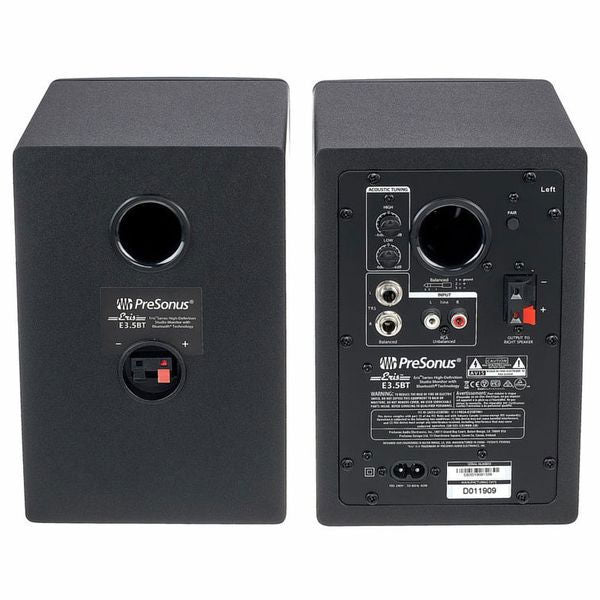 Back view of dark studio monitors with ports, switches, and connection panel