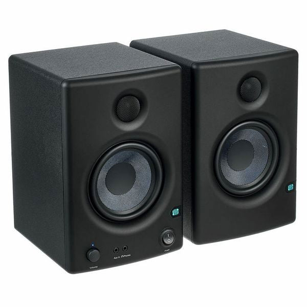 Studio monitor speaker pair in black, angled view showing tweeters and woofers