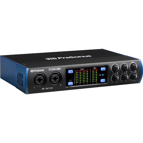 Black USB-C audio interface with display meters and control knobs