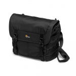 Black camera bag with side pocket, top flap, and adjustable shoulder strap