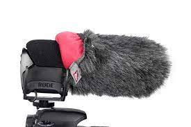 Gray furry microphone windscreen with red inner panel on a compact mic mount