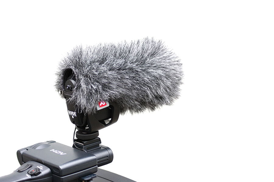 Gray furry mic windscreen with shock mount on a video camera bracket