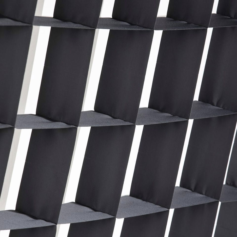 Close-up of black SNAPGRID square grid panel and padded ridges