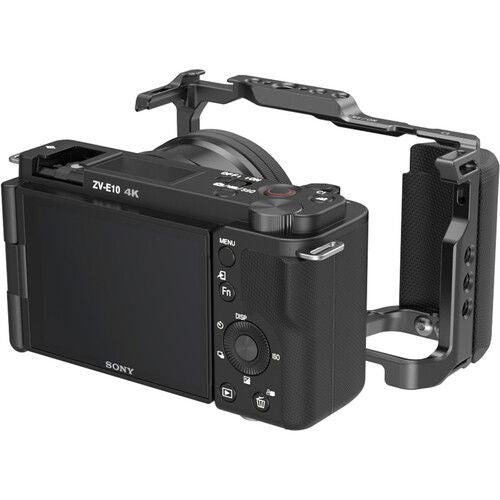 Sony ZV-E10 in camera cage with right-side handle grip, black metal and textured controller